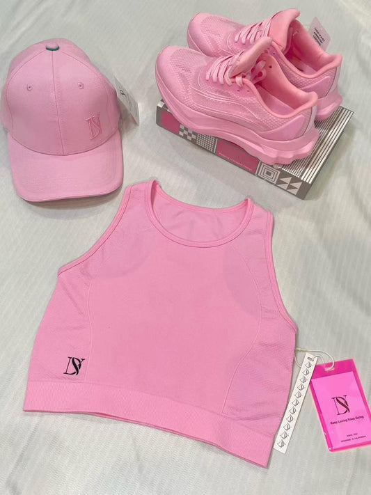 Women's sports set: crop top, sneakers and cap, for training, gym, yoga and fitness.